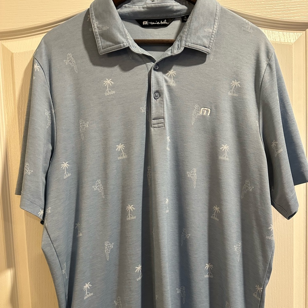 Travis Mathew Sky Blue Polo with Palm Embroidery